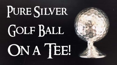 Casting a Silver Golf Ball On a Tee